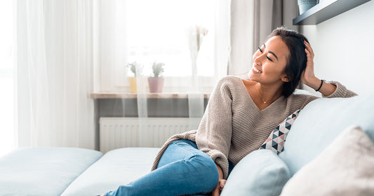 woman smiling on couch