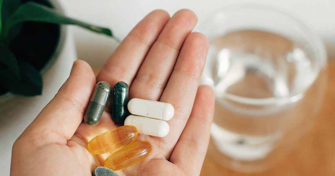 hand holding vitamins