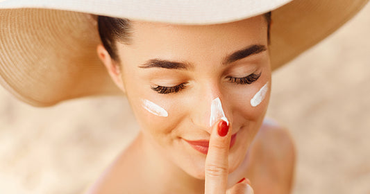 woman applying sunscreen