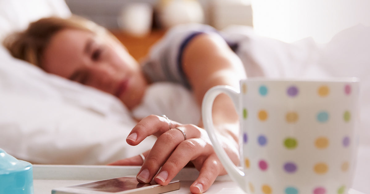 woman reaching for phone