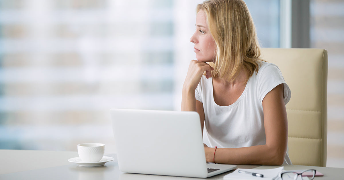 woman looking at laptop