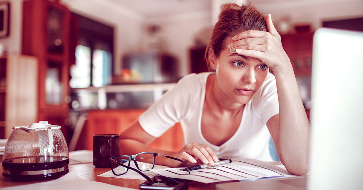 woman looking at the computer screen and being stressed
