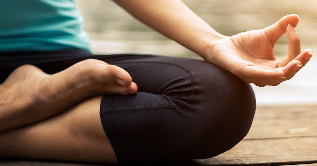 woman with legs crossed for yoga